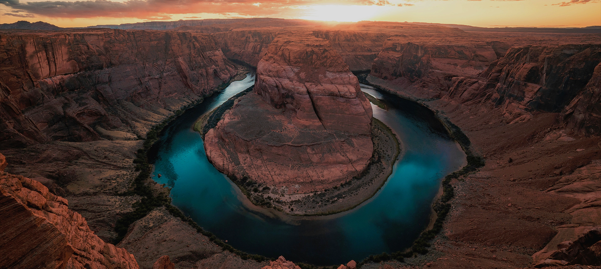 A river that is surrounded by mountains.